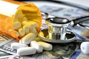 stethoscope laying on medicine white pills money 2022 08 01 04 11 38 utc 1